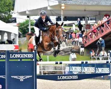 Andrew Ramsay and Cocq A Doodle on top in Bromont