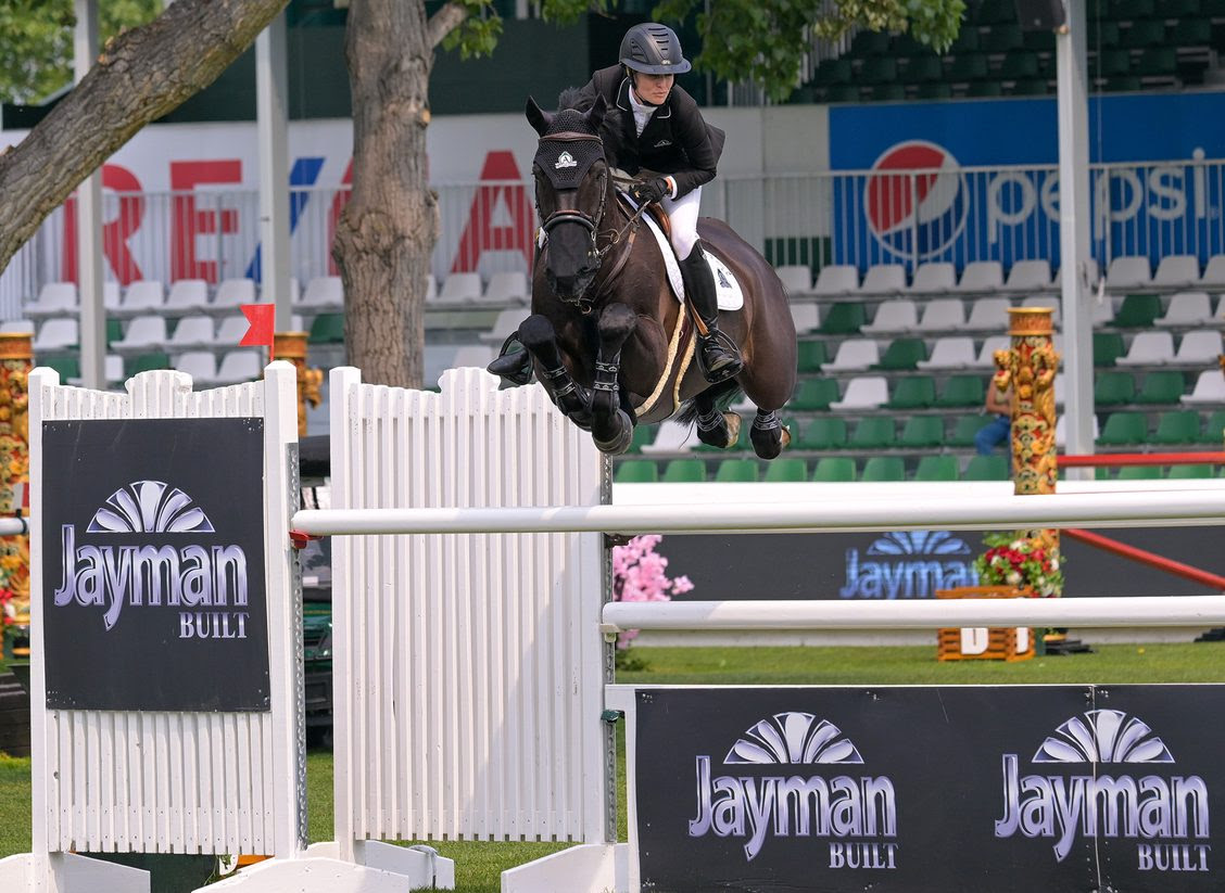 Canada’s Tiffany Foster and Battlecry jump to the 1.55m win at Spruce Meadows